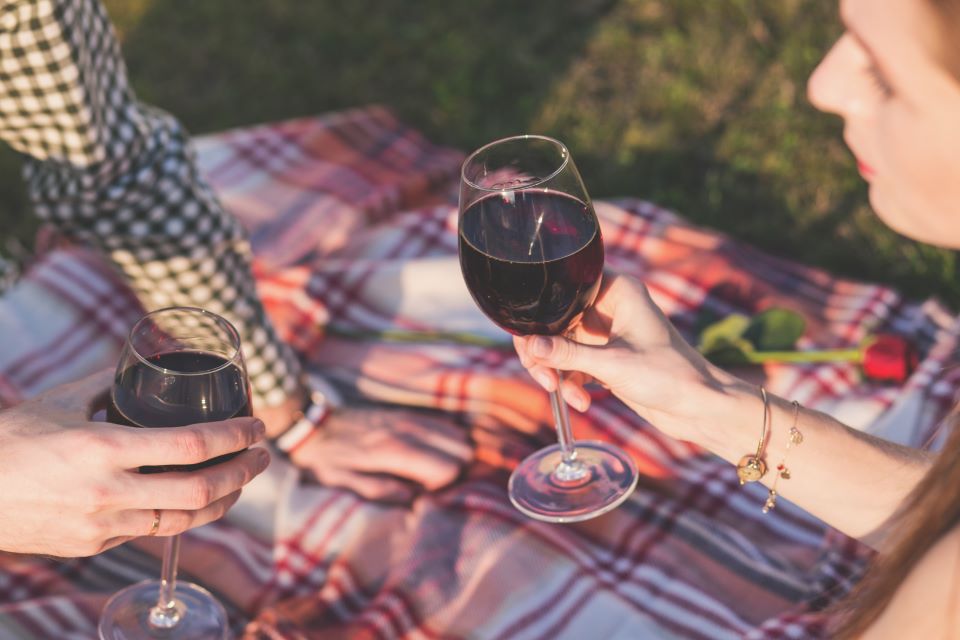 Couple holding wine glasses